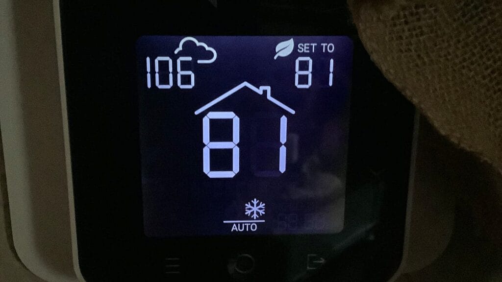 Thermostat set to 81 degrees Fahrenheit