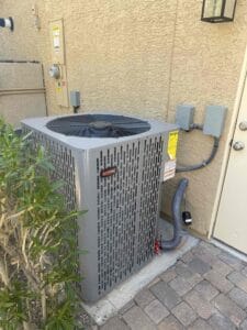 Exterior shot of the newly installed RunTru 4-ton condenser next to the home’s electrical meter.
