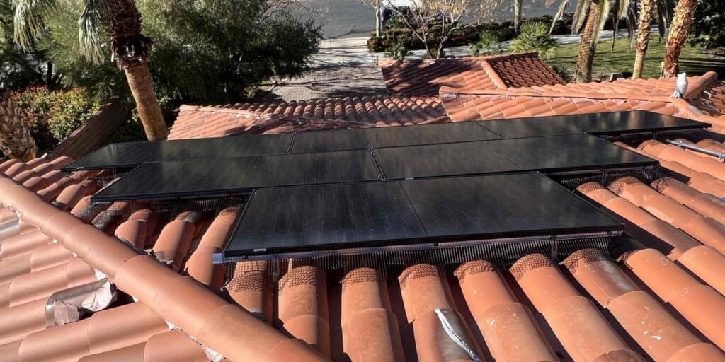 A newly installed solar array sits flush against a red tile roof, showing the kind of rooftop planning that goes into new construction HVAC in the Las Vegas Valley.